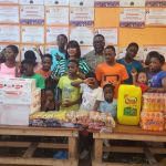 A joyful outreach visit bringing food, prayer, and encouragement to orphaned children.